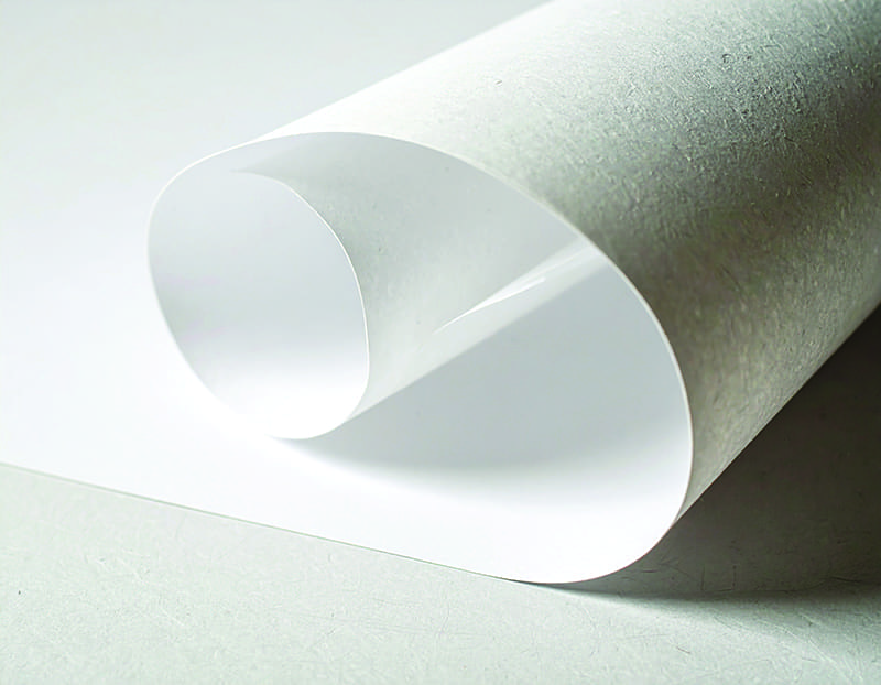 White paper roll with textured surface, ideal for paper and packaging supplier.